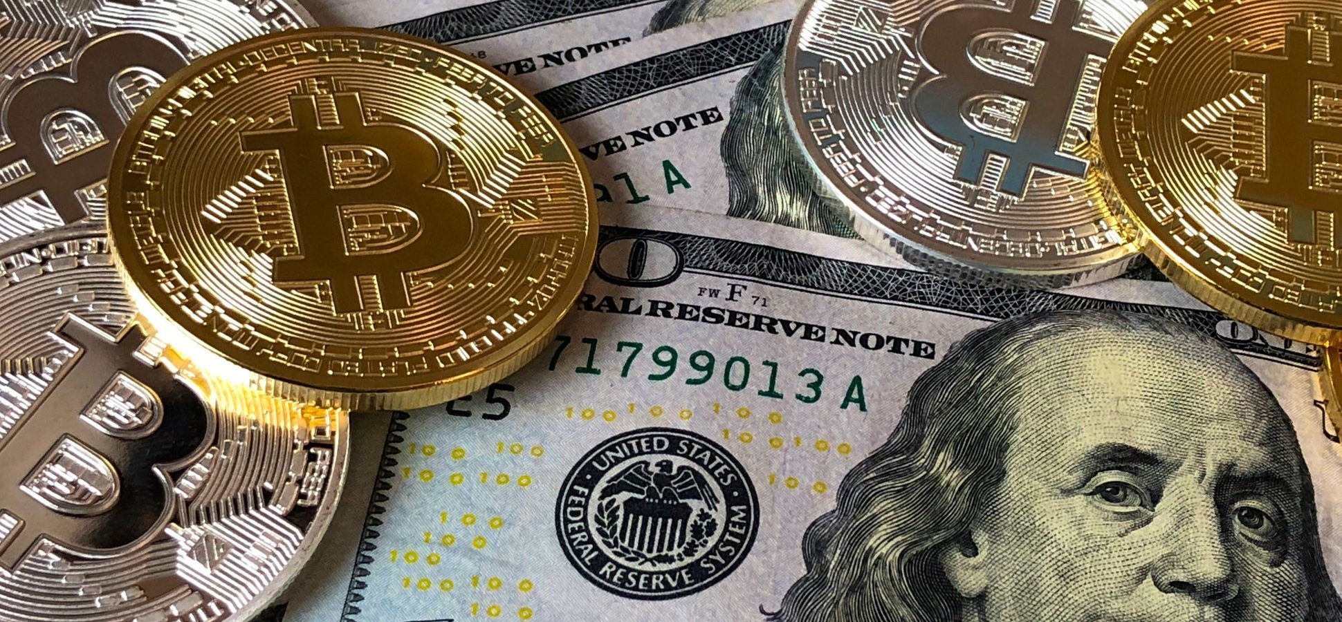 Bitcoin coin on a trading chart as bitcoin ETF inflows return