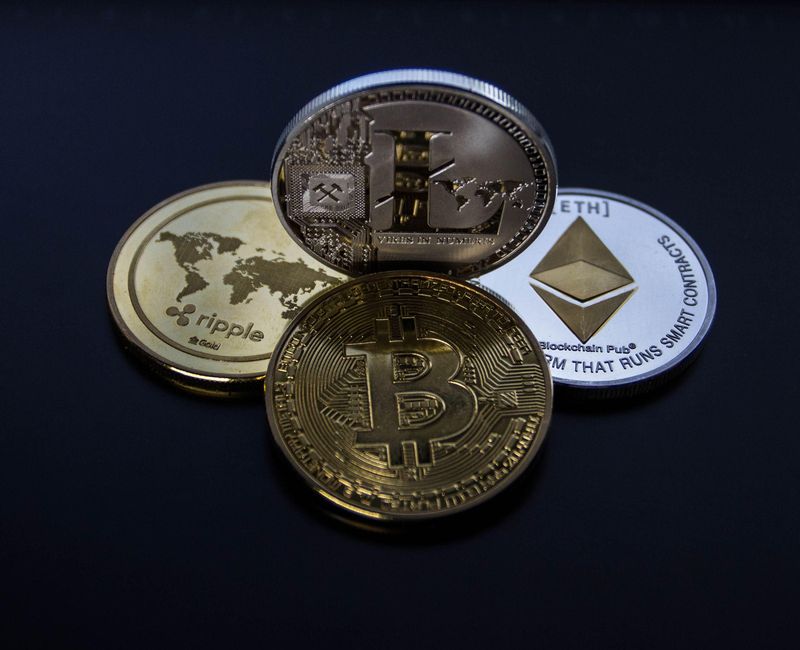 Cryptocurrency coins representing the crypto market rebound after Fed chair comments