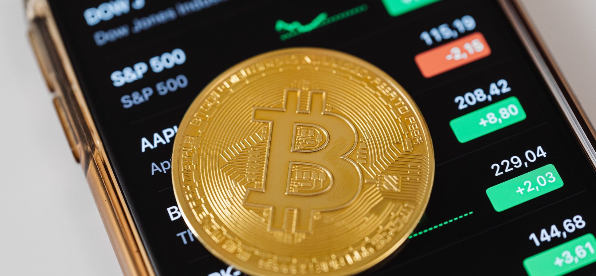 Bitcoin coin over a stock ticker screen as Empery Digital sells bitcoin to fund an AI data center