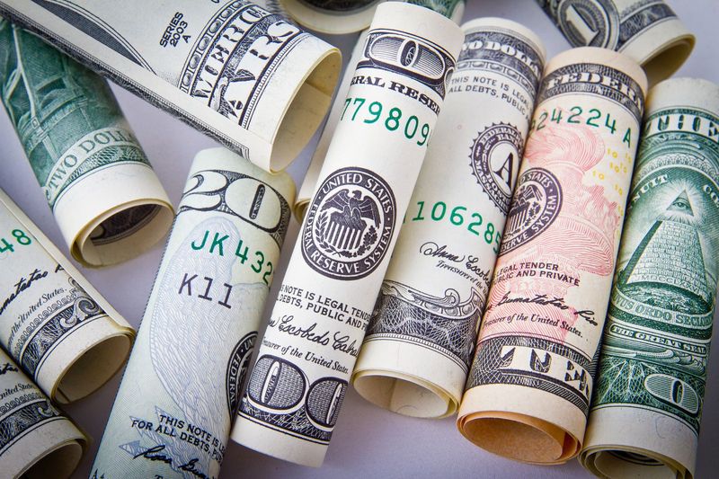 US dollar bills representing stablecoin reserves backing Open USD