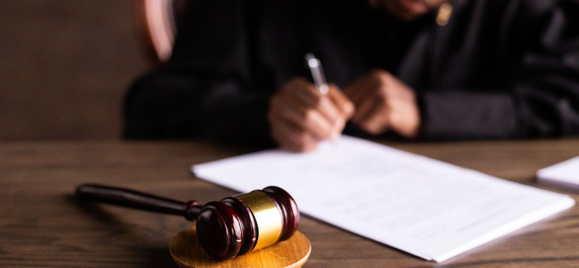Judge signing a court order in the Coinbase prediction markets ruling