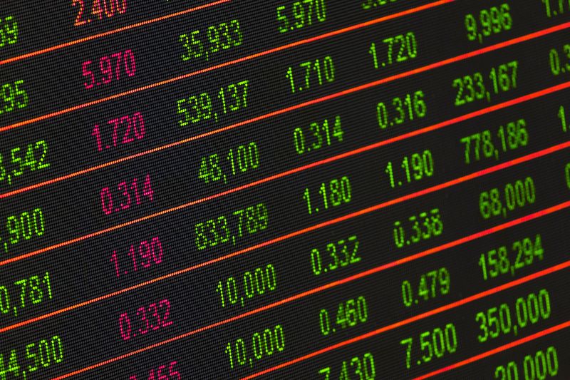 Digital stock exchange board showing crypto and market prices after Schwab's Solana Avalanche Chainlink announcement