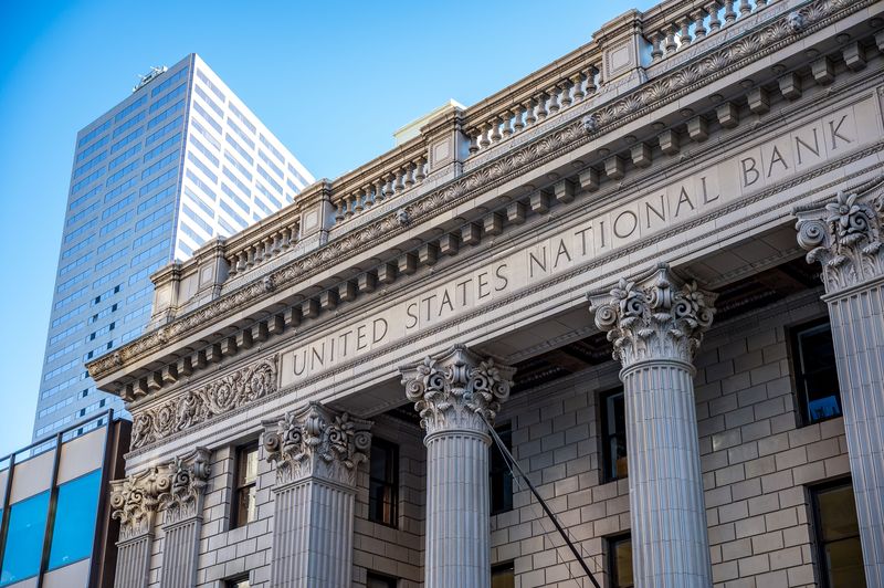 Classical bank facade representing Fed master account access for state-chartered banks