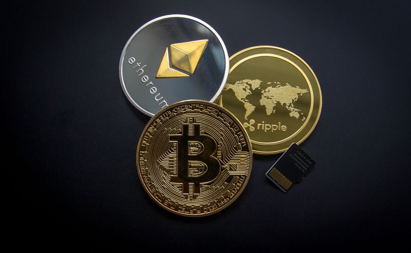 Crypto tokens on a dark surface illustrating the Harmony ONE exploit and price crash