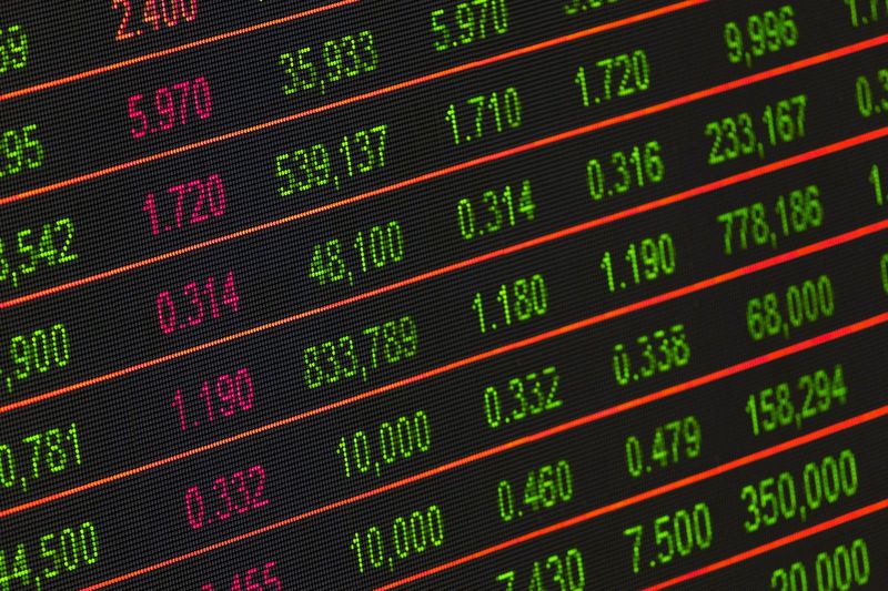 US stock market ticker board reflecting the equities now available through Coinbase UK stock trading