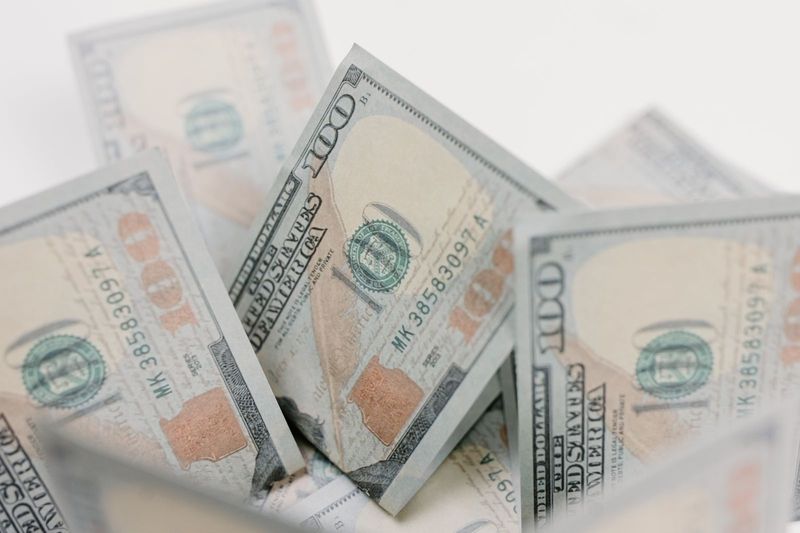 US hundred dollar bills representing USD1 stablecoin reserves under the World Liberty bank charter